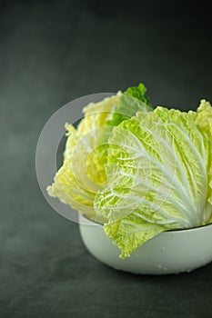 Heap fresh of green chopped iceberg lettuce in bowl