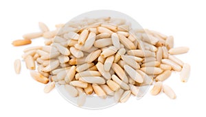 Heap of fresh Pine Nuts over white