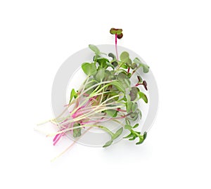 Heap of fresh radish microgreens on white background, top view