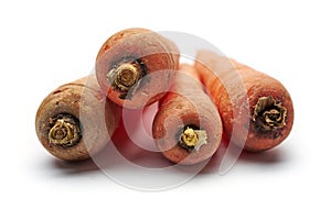 Heap of fresh raw carrots isolated on white background