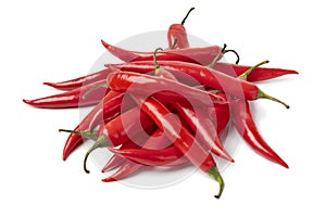 Heap of fresh red hot chili peppers isolated on white background