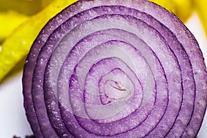 A heap of fresh sliced red onion rings. Image on