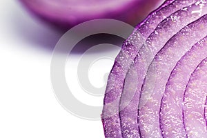 A heap of fresh sliced red onion rings. Image on
