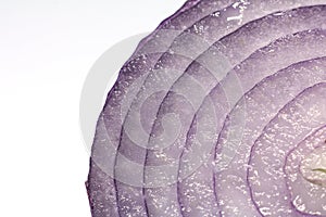 A heap of fresh sliced red onion rings. Image isolated on