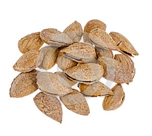 Heap of fresh unpeeled almonds isolated on white background