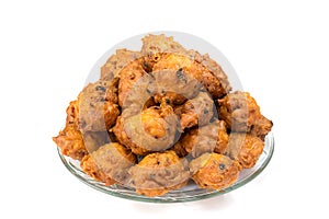 Heap of fried fritters or oliebollen on scale