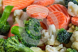 Heap of frozen vegetable mix close-up on a white background. Isolated