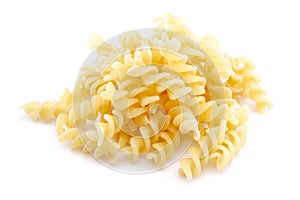 Heap of Fusilli pasta isolated on white