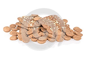 Heap of ginger nuts with speculaas isolated over white