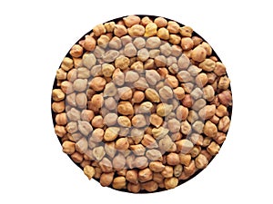 heap of Gram lentils pulses held in bowl isolated against white