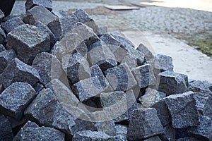 Heap of gray cobbles prepared on the construction site