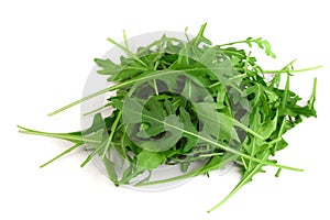 Heap of Green fresh rucola or arugula leaf isolated on white background