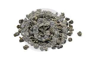 Heap of green gunpowder tea isolated on white background