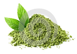 Heap of green matcha tea powder and leaves