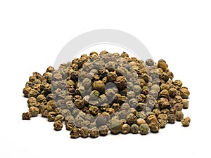 A heap of green peppercorns on white background
