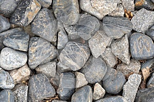 Heap grey stone for design in park and garden. Geometric pebbles.