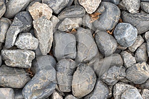 Heap grey stone for design in park and garden. Geometric pebbles.