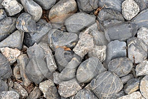 Heap grey stone for design in park and garden. Geometric pebbles.