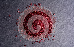 Heap ground sumach on stone background