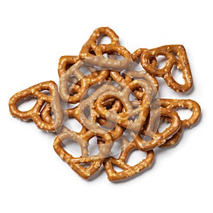 Heap of heart shaped pretzels on white background close up photo