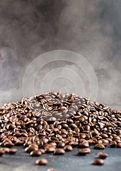 Heap of hot roasted coffee beans with steam