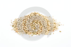 a heap of hulled hemp seeds on a white surface