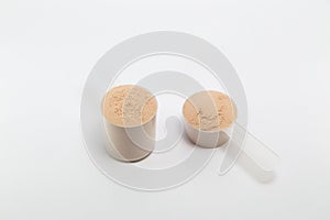 Heap of isolate and chocolate protein powder.