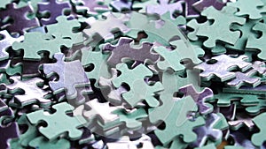 Heap of jigsaw puzzle pieces. Falling disconnected mixed game elements