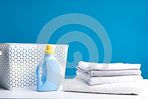 Heap of linens and detergent on table