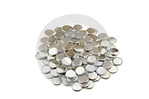 Heap of lithium button cell batteries. Isolated on white background. Closeup