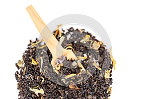 Heap of loose leaf black and green tea blend isolated on a white