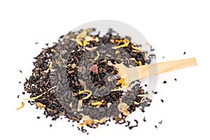 Heap of loose leaf black and green tea blend isolated on a white