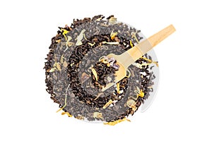 Heap of loose leaf black and green tea blend isolated on a white