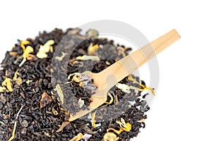 Heap of loose leaf black and green tea blend isolated on a white