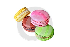 Heap of macaroons with different colors and varied taste, lemon, almond, chocolate, raspberry, strawberry and mint isolated