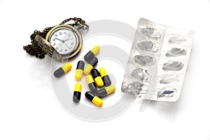 Heap medicine capsule, medicine pack and old silver pocket watch