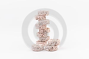 Heap of medicine colored pills, tablets on a white background