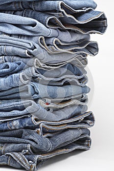 Heap of modern designer blue jeans
