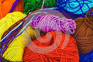 Heap of multi-colored balls of thread background, close-up