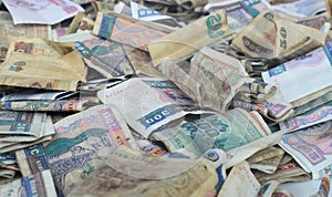 Heap of old Myanmar money. Stacks of Burmese banknotes