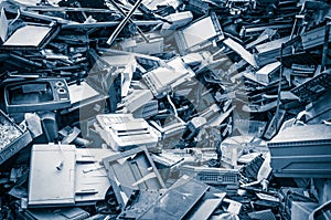 Heap of old scrap metal mainly consist of household appliance in a scrap yard