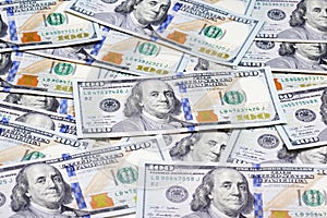 Heap of one hundred dollar banknotes