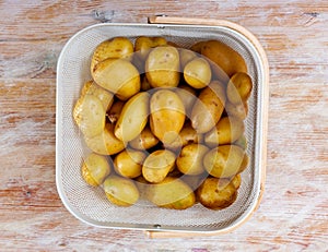 Heap of organic new potatoes in basket