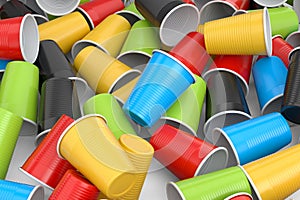 Heap of pastic disposable party cup for juice, fresh, beer on white background.