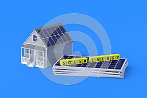 Heap of photovoltaic panels near cubes with inscription solar energy and house