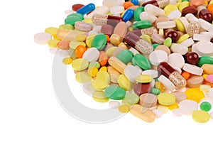 Heap of pills on white background