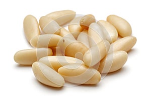 Heap of pine nuts isolated on white