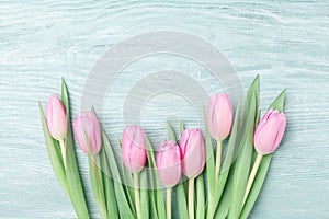 Heap of pink tulips for March 8, International Womans or Mothers day. Beautiful spring background. Top view.