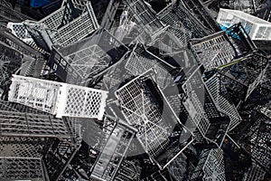 heap of plastic crates prepared for recycling