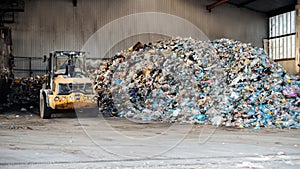 Heap of plastic garbage at waste sorting plant